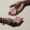 woman hands holding rose quartz ccrystal